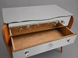 an image of a mirrored chest of drawers with a drawer underneath it