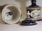 two vases sitting next to each other on a table