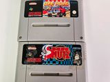 two nintendo game cartridges sitting next to each other on a table