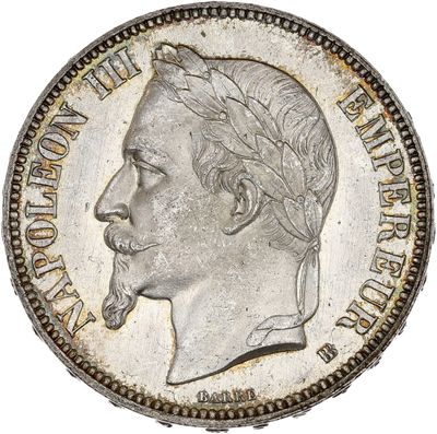 Gros plan sur une pièce d'argent portant le visage d'un homme
