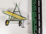 a green toy airplane and a yellow toy plane
