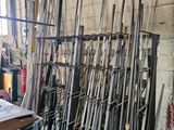 a lot of baseball bats that are sitting in a room
