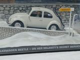 a white toy car in a clear box on a table