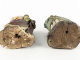two pieces of wood sitting next to each other on a white surface