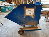 a blue dumpster with a sign on the side of it