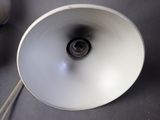 a close up of a white lamp on a table