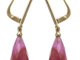 a pair of earrings with pink stones and diamonds