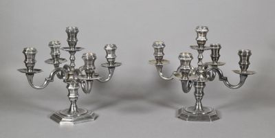 pair of silver plated candelabs with candlesticks on stands
