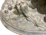 a statue of a man riding a horse with a bird on its back