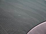 a small airplane that is flying over the water