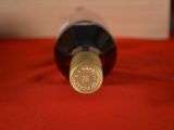 a bottle of wine that is sitting on a table