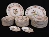 a lot of plates that are sitting on a table