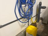 a yellow container with a blue hose and a yellow container with a blue hose on it