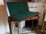 a small table with a green cover on it in a room