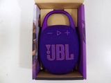 purple jbl charge 3 portable speaker in a cardboard box