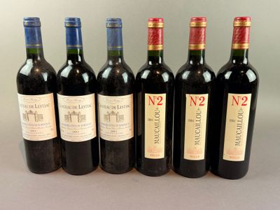 six bottles of wine are lined up in a row on a table