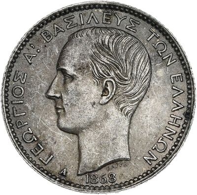gros plan d'une pièce de monnaie sur laquelle figure un visage de femme