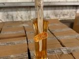 a glass bottle with a flower inside of it