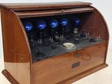 a wooden display case with blue lights inside of it