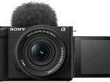 a black camera with a microphone attached to it