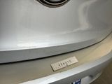 a close up of a badge on a car ' s front bumper