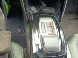 a close up of a car ' s gear box and dashboard