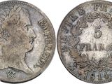 a close up of a coin with a woman ' s face on it