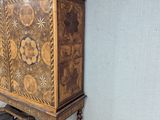 a cabinet that is sitting in the corner of a room