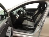 the interior of a car with the door open and the driver ' s seat down
