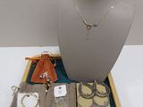 a display of jewelry on a tray on a table