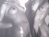 black and white photograph of two naked women standing next to each other
