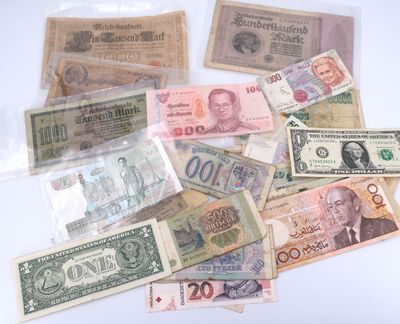 a lot of different bank notes on the table