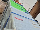 a large pile of construction materials sitting on the side of a building