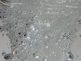 a close up of a glass with water in it