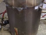 an image of a large metal container with a pressure gauge