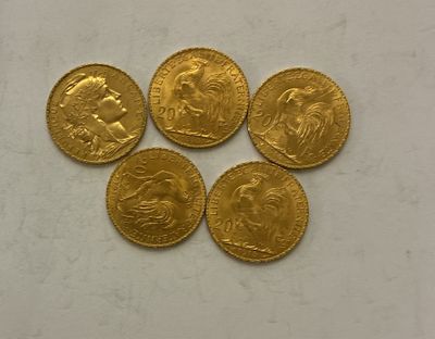 four gold sovereigns, one of which is a sovereign and one of which is a sovereign