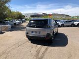 many cars parked in a parking lot in a lot