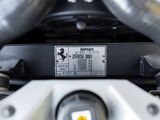 a close up of a motorcycle ' s engine with a sticker on it
