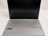 a laptop computer sitting on top of a white table