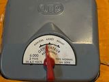 a box with a thermometer in it on a table