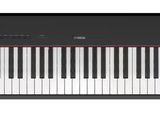 a black and white piano with a red line on the keyboard
