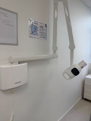 an image of a hospital room with a bed and a monitor