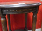 a small table with a wooden top and a small table with a wooden top