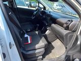 the interior of a car with the door open and the driver ' s seat in the passenger seat