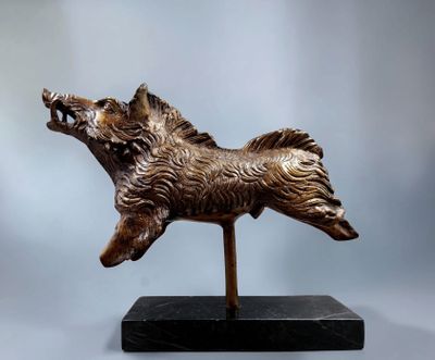bronze sculpture of a dog on a black base on a gray background