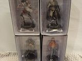 three boxes of star wars action figures sit on a table
