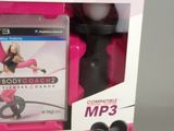 a pink box with a video game and headphones in it