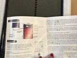 a person holding a book open to a page of information