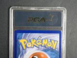 the pokemon trading card is in a plastic holder