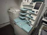 an image of a hospital room with a washing machine and other medical equipment